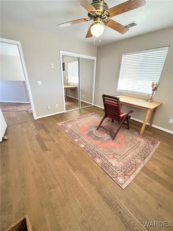 office with wood finished floors, a wealth of natural light, and baseboards