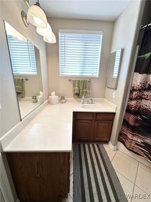 full bath with tile patterned floors and vanity