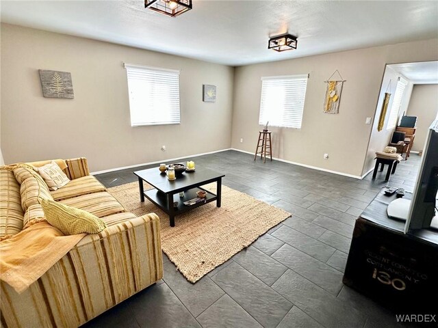 living room featuring baseboards