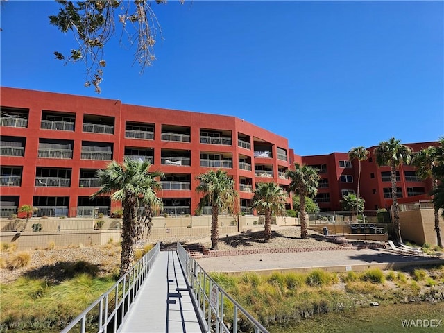 view of building exterior with fence