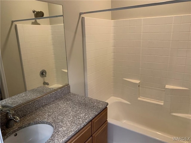 bathroom featuring vanity and bathing tub / shower combination