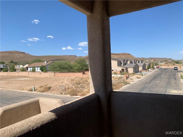 exterior space with a residential view and a mountain view