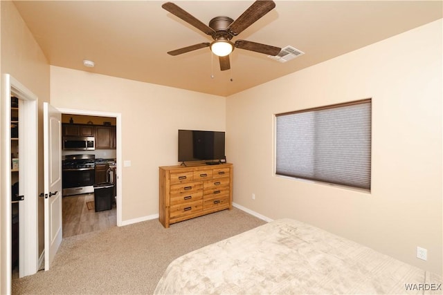 bedroom with baseboards, ceiling fan, visible vents, and light colored carpet