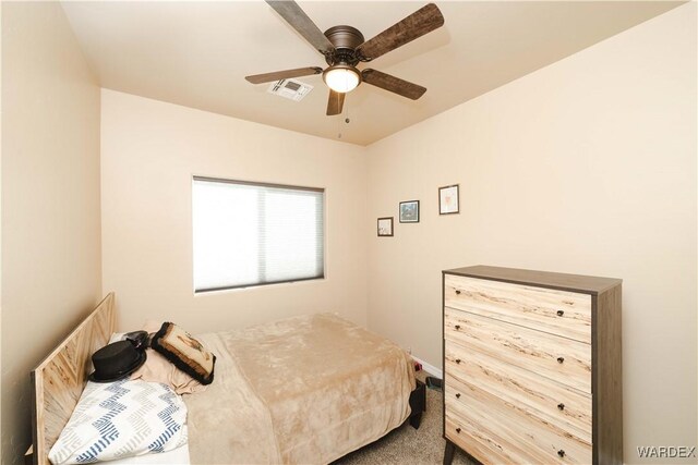 bedroom with carpet floors, visible vents, and a ceiling fan