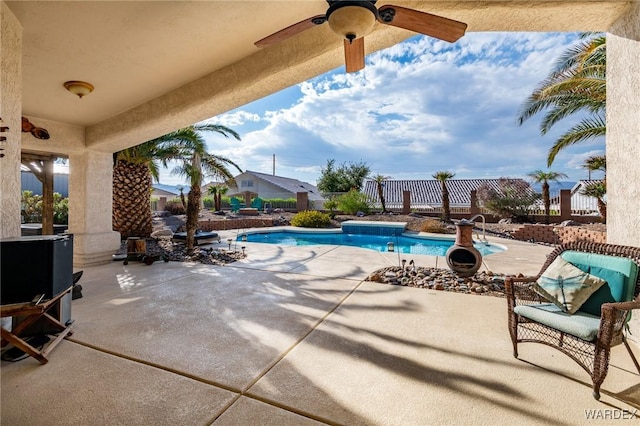 view of pool featuring a fenced in pool, a patio, ceiling fan, and fence