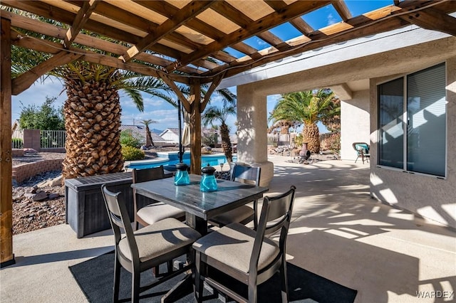 view of patio / terrace with outdoor dining area, an outdoor pool, fence, and a pergola