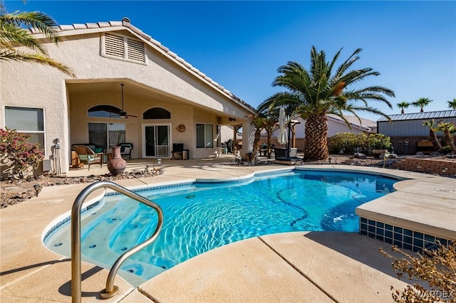 view of swimming pool featuring a ceiling fan, a fenced in pool, and a patio area