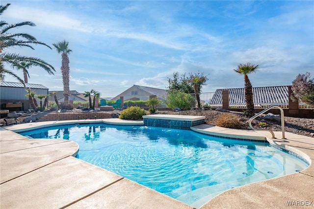 outdoor pool featuring fence