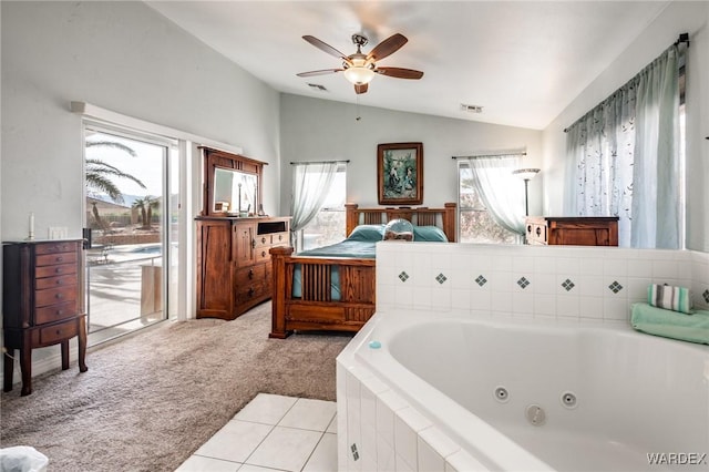 bathroom with visible vents, a ceiling fan, a jetted tub, tile patterned flooring, and vaulted ceiling