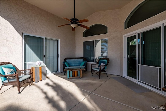 view of patio / terrace with a ceiling fan and an outdoor living space