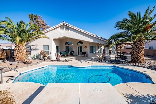 view of pool featuring fence, a fenced in pool, and a patio