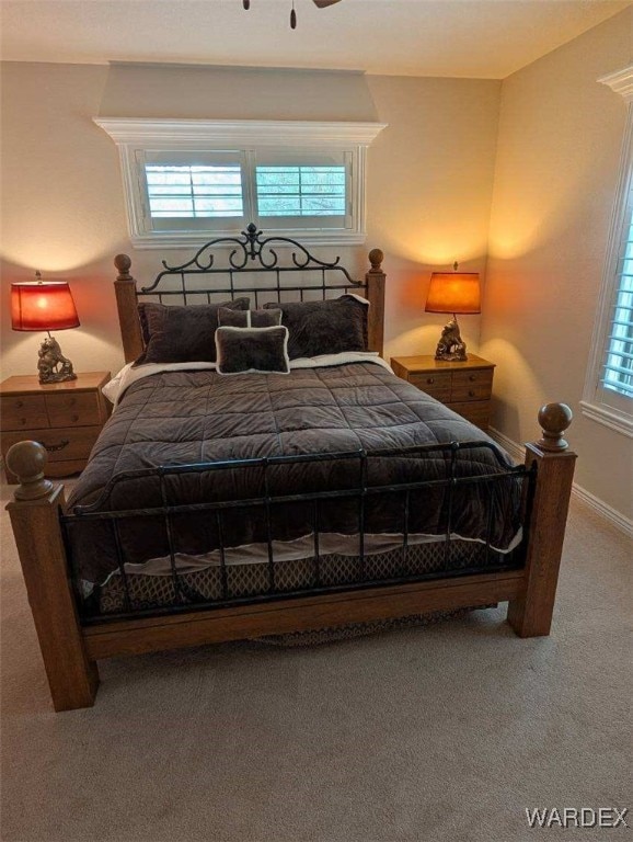 carpeted bedroom with baseboards