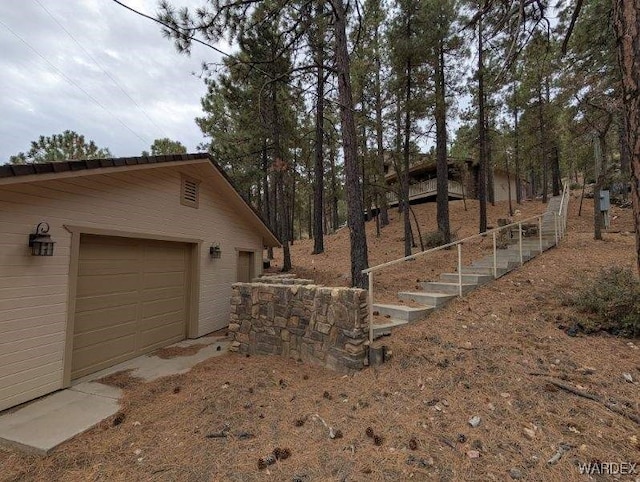 view of home's exterior with an outdoor structure