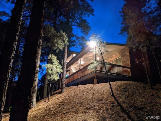 rear view of house featuring a deck