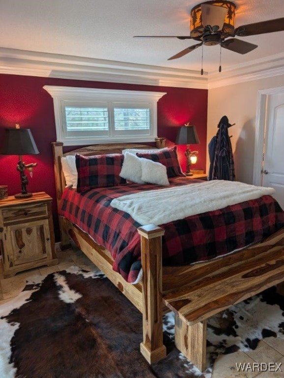 bedroom featuring crown molding and ceiling fan