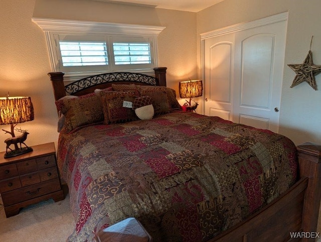 carpeted bedroom featuring a closet