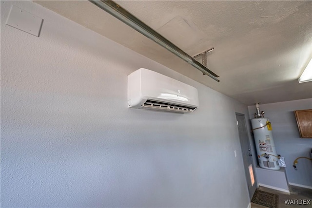 2970 E Devlin Ave, Kingman, AZ 86409 - room details featuring baseboards, a wall mounted AC, and water heater