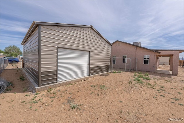 2970 E Devlin Ave, Kingman, AZ 86409 - exterior space featuring fence, an outdoor structure, and a garage