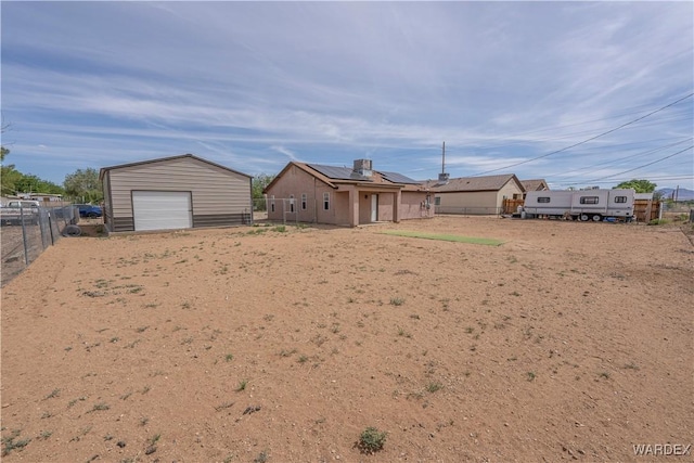 2970 E Devlin Ave, Kingman, AZ 86409 - view of yard featuring a garage, a fenced backyard, and an outbuilding