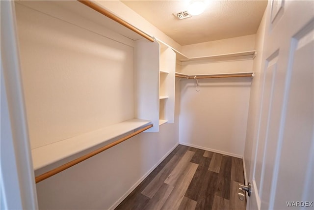 2970 E Devlin Ave, Kingman, AZ 86409 - walk in closet with dark wood-type flooring and visible vents
