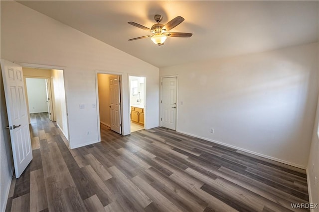 2970 E Devlin Ave, Kingman, AZ 86409 - unfurnished bedroom with baseboards, dark wood-type flooring, and vaulted ceiling