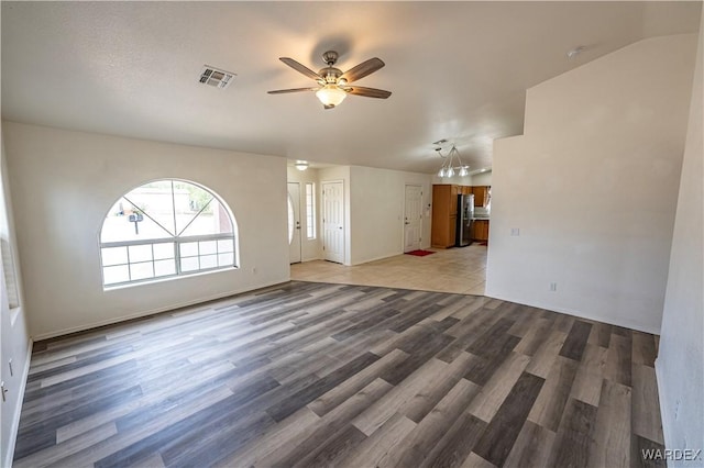 2970 E Devlin Ave, Kingman, AZ 86409 - unfurnished living room with visible vents, a ceiling fan, and wood finished floors