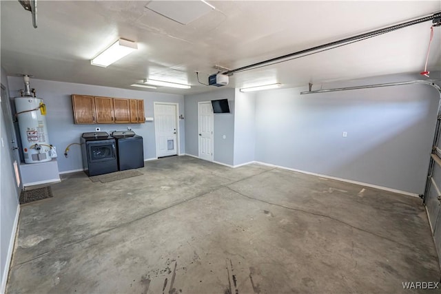 2970 E Devlin Ave, Kingman, AZ 86409 - garage featuring secured water heater, independent washer and dryer, baseboards, and a garage door opener