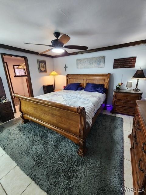 10626 Fenton Dr, Parker, AZ 85344 - bedroom featuring crown molding, ceiling fan, and light tile patterned flooring