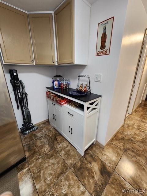 10626 Fenton Dr, Parker, AZ 85344 - interior space with dark countertops and stone finish floor