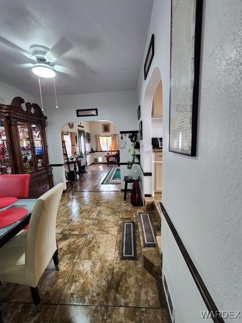 10626 Fenton Dr, Parker, AZ 85344 - hall with arched walkways and a textured wall