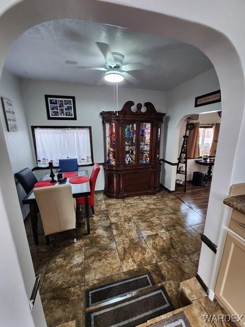 10626 Fenton Dr, Parker, AZ 85344 - dining room with arched walkways and ceiling fan