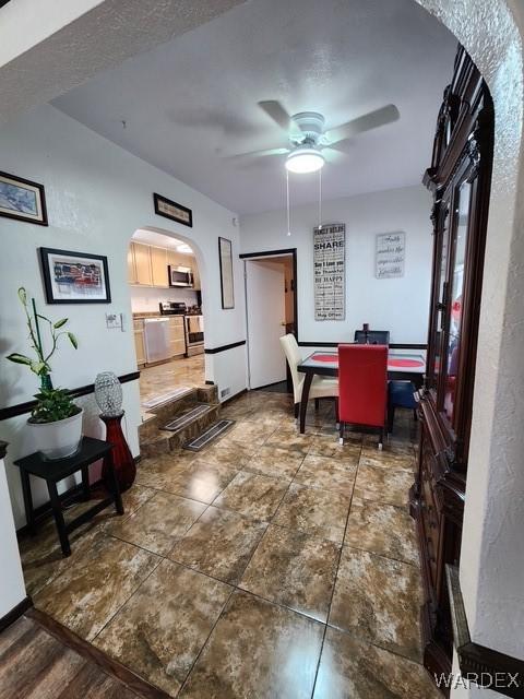 10626 Fenton Dr, Parker, AZ 85344 - dining space with ceiling fan and arched walkways
