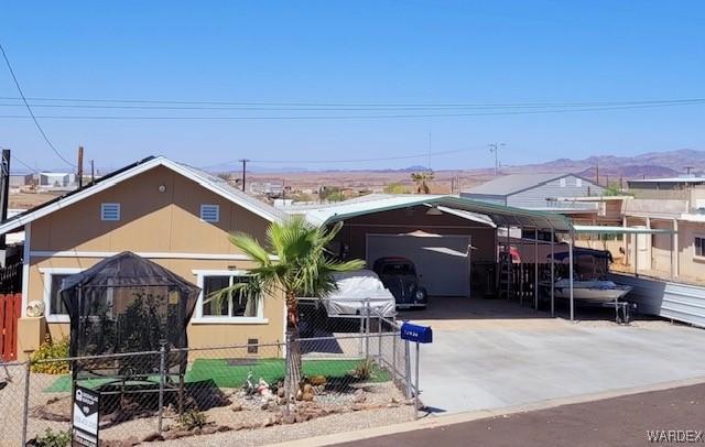 10626 Fenton Dr, Parker, AZ 85344 - view of front facade with driveway and a fenced front yard