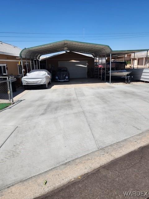 10626 Fenton Dr, Parker, AZ 85344 - view of parking featuring a detached carport and a garage