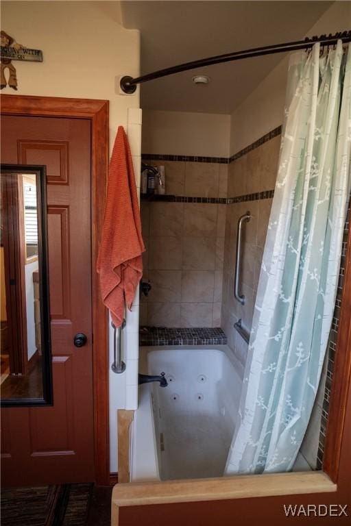 full bathroom with tiled shower / bath combo