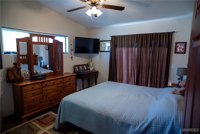 bedroom featuring vaulted ceiling and ceiling fan