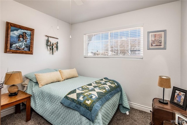 bedroom featuring carpet and baseboards