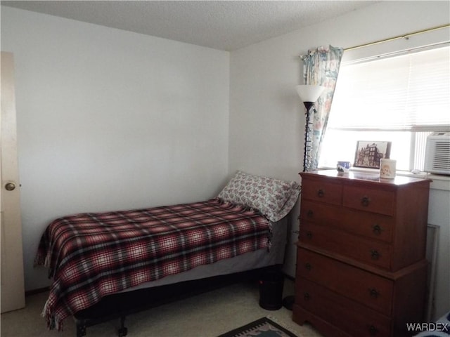 bedroom featuring light colored carpet