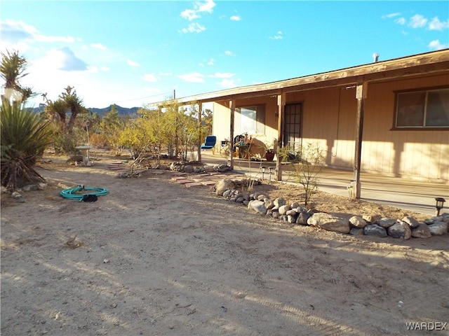 view of home's exterior with a mountain view