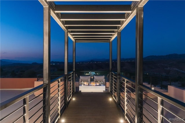 view of balcony at dusk