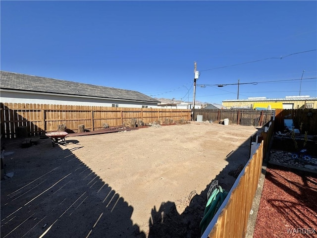 view of yard with a fenced backyard