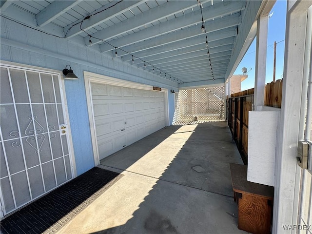 garage with concrete driveway