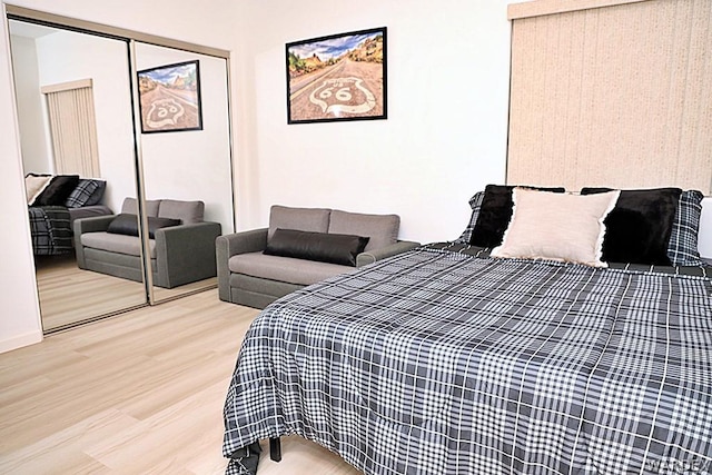 bedroom featuring a closet and wood finished floors