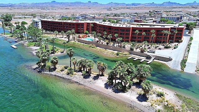 drone / aerial view featuring a water and mountain view