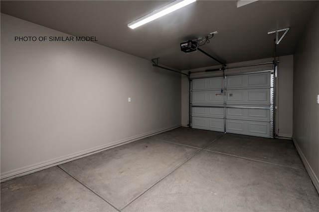 garage with a garage door opener and baseboards
