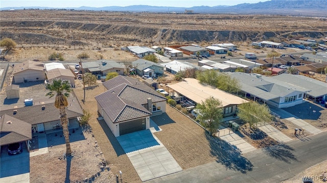 birds eye view of property with a residential view and a mountain view