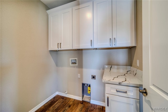 laundry room featuring cabinet space, baseboards, dark wood finished floors, washer hookup, and electric dryer hookup