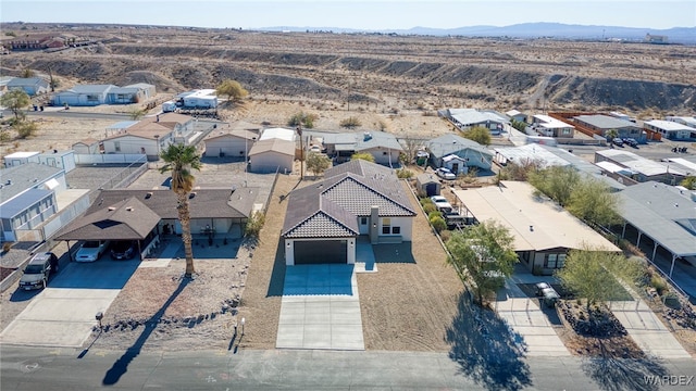 bird's eye view featuring a residential view and a mountain view