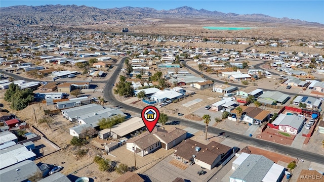 drone / aerial view with a residential view and a mountain view