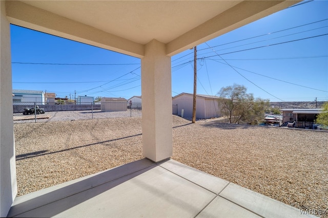 view of yard featuring a patio and fence